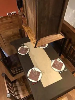 a table with three plates on top of it at H Rural Chamouco in Bóveda
