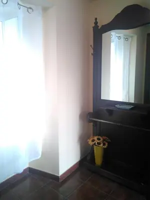 a bathroom with a mirror and a sink at Casa Laguiñas en Castro Caldelas in Castro Caldelas