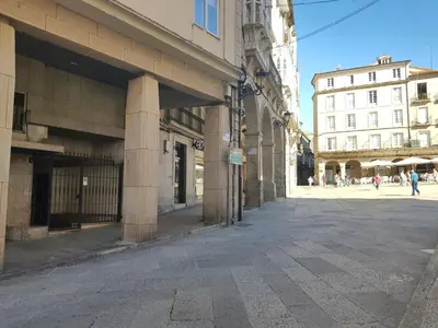 an empty street in a city with buildings at QUATRE CASAS in Ourense