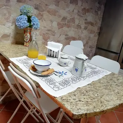 a table with a table cloth on it with a table at A Fragua in Tapia de Casariego