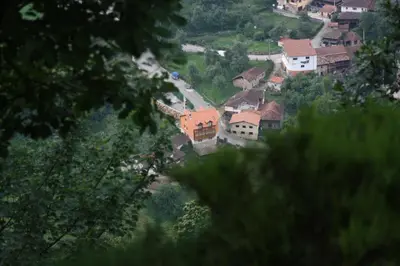 a view of a town with houses on a hill at Apartamentos Valdecarzana Senda del Oso in San Martín