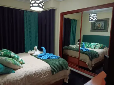 a bedroom with two beds and a large mirror at Piso zona Campus-Lagunas in Ourense