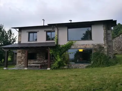 a house on a hill with a stone facade at TOURON Nº1 in Carballedo