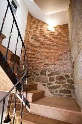 a brick wall and stairs in a room at Vintage Ribadavia in Ribadavia