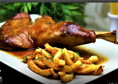 a piece of chicken and french fries on a plate at Hotel A Forxa Cafetería Restaurante in Carballeira