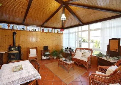a large living room with chairs and a table at Casa Elena Turismo Rural in Reinante