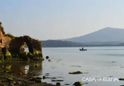 a person in a boat on the water at Casa Elena Turismo Rural in Reinante