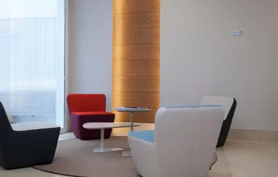 a group of chairs and tables in a room at Hotel Gelmírez in Santiago de Compostela