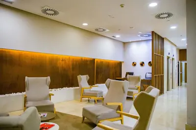 a waiting room with chairs and a waiting table at Hotel Gelmírez in Santiago de Compostela