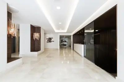 a hallway of a building with a white floor at Hotel Gelmírez in Santiago de Compostela