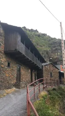 a bridge on the side of a brick building at Casa Do Concello in Arnado