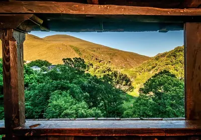 an open window with a view of a mountain at Casa Do Concello in Arnado