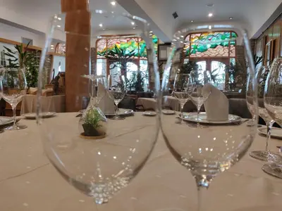 a long table with wine glasses on it at Hotel Chef Rivera in Padrón