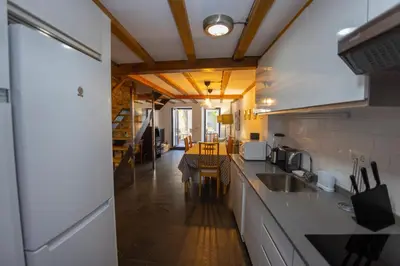 a kitchen with a sink and a counter top at Casa Jovellanos de Casas Das Figueiras en Ría Eo-Ribadeo in Castropol