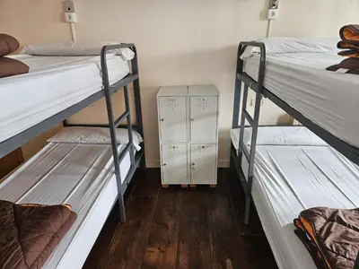 a bedroom with two bunk beds in a room at Albergue Azabache in Santiago de Compostela