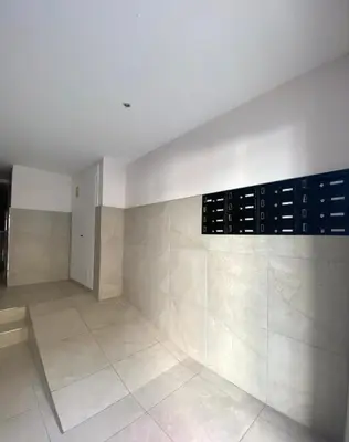 a large room with a tile floor and a white wall at Lemos Luna in Monforte de Lemos