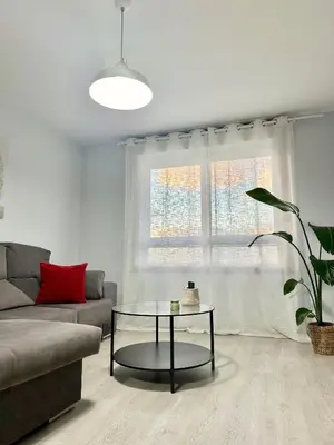 a living room with a couch and a glass table at Lemos Luna in Monforte de Lemos