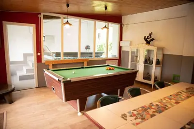 a room with a pool table in a room with at Casa de Piñeiro y SPA Opcional con coste extra in Santiago de Compostela