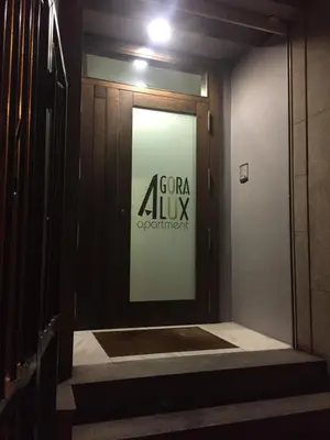 a door to a room with a sign on the wall at ÁGORA LUX in Ourense