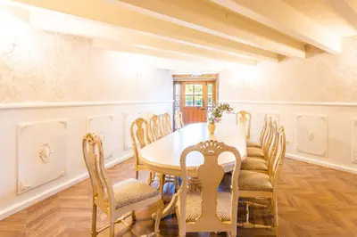 a dining room with a table and chairs at Eira Grande Galicia Villas in Pedre