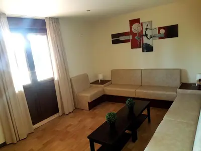 a living room with a couch and a table at Albergue Piñeiral Fonsagrada in Fonsagrada