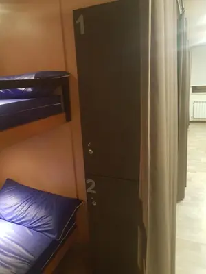 a room with a bunk bed and a closet at Albergue Piñeiral Fonsagrada in Fonsagrada