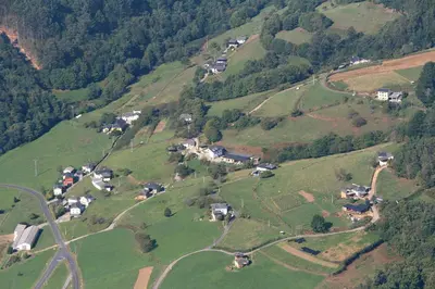 an aerial view of a village on a hill at Apartamentos Rurales Casa El Caminero in Merás