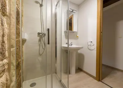 a bathroom with a shower and a sink at Gran Casa Rural A Touza in Ourense