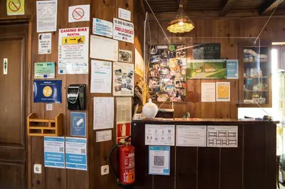 a room with a wall with many signs on it at A Reboleira - Casa Nuñez in Fonfría