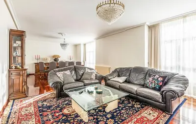 a living room with two leather couches and a coffee table at POSTA Do SOL in Baralla