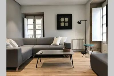 a living room with a couch and a coffee table at Plaza Mayor in Ourense