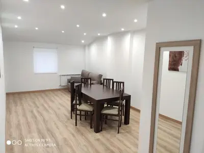 a dining room with a table and chairs in a room at Villa Trabazos Abellas in Ourense