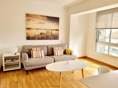 a living room with a couch and a table at Amplio piso próximo a la Catedral y el Camino. C2 in Santiago de Compostela
