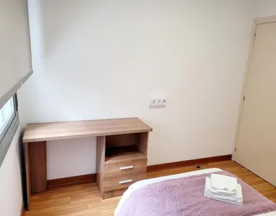 a bedroom with a bed and a desk at Amplio piso próximo a la Catedral y el Camino. C2 in Santiago de Compostela