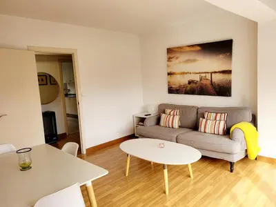 a living room with a couch and a table at Amplio piso próximo a la Catedral y el Camino. C2 in Santiago de Compostela