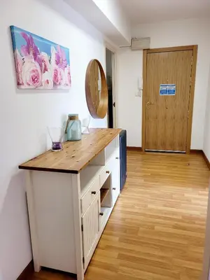 a kitchen with a wooden counter in a room at Amplio piso próximo a la Catedral y el Camino. C2 in Santiago de Compostela
