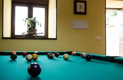 a pool table with billiard balls on it at Apartamentos Rurales San Xillao in Ribadeo