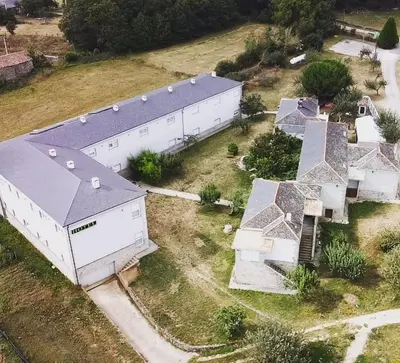 an overhead view of a large white building at HOTEL AS MACEIRAS in Trives