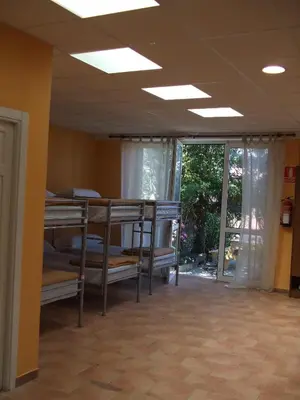 a room with several bunk beds in it at Obradoiro in Sarria