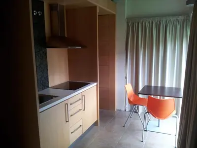 a kitchen with a table and a table and chairs at PR Albeitaría in Reis