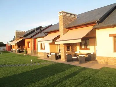 a row of houses with grass in front of them at APARTAMENTOS FONTE VILLAR in Navia