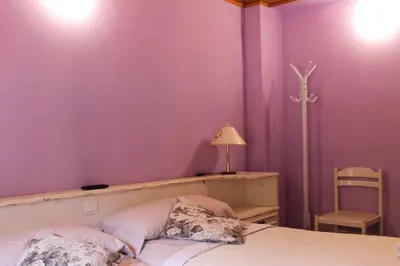 a living room with a large wooden entertainment center at La Puchera in Cangas del Narcea