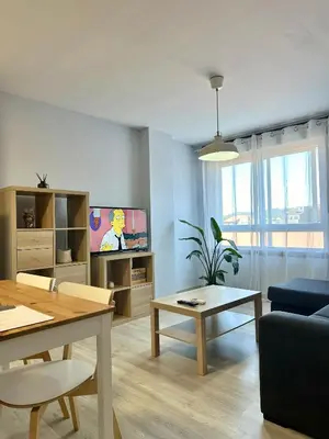 a living room with a couch and a table at Lemos Nube in Monforte de Lemos