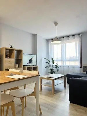 a living room with a table and a couch at Lemos Nube in Monforte de Lemos