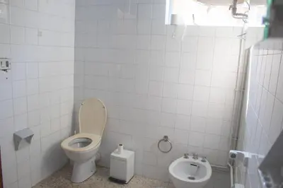 a bathroom with a toilet and a bidet at Albergue Santa Olaia in Silleda
