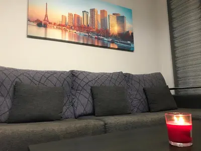 a living room with a couch with a candle on a table at lucushouse I in Lugo