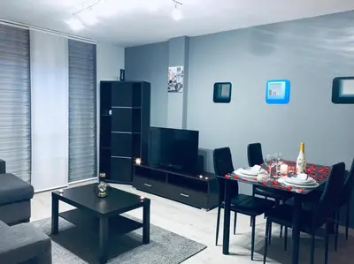 a living room with a table and a dining room at lucushouse I in Lugo