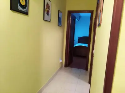 a hallway with a door leading to a bedroom at jucar carmen in Santiago de Compostela