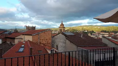 a view of a city with roofs of buildings at Luna - Disfruta de Ourense en este piso con terraza en el casco histórico in Ourense