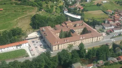 an overhead view of a large building in a town at Parador de Corias in Cangas del Narcea